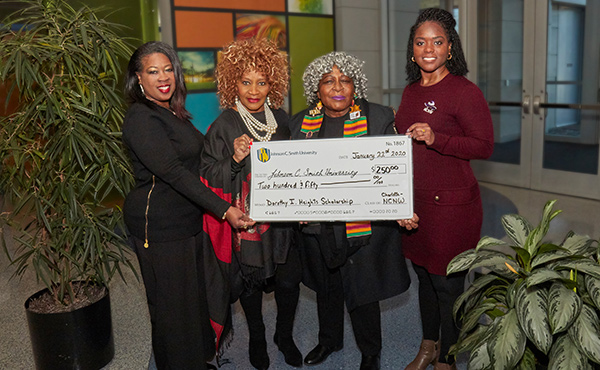 Group shot holding the check for $250 for the Dorothy I. Height Scholarship Fund