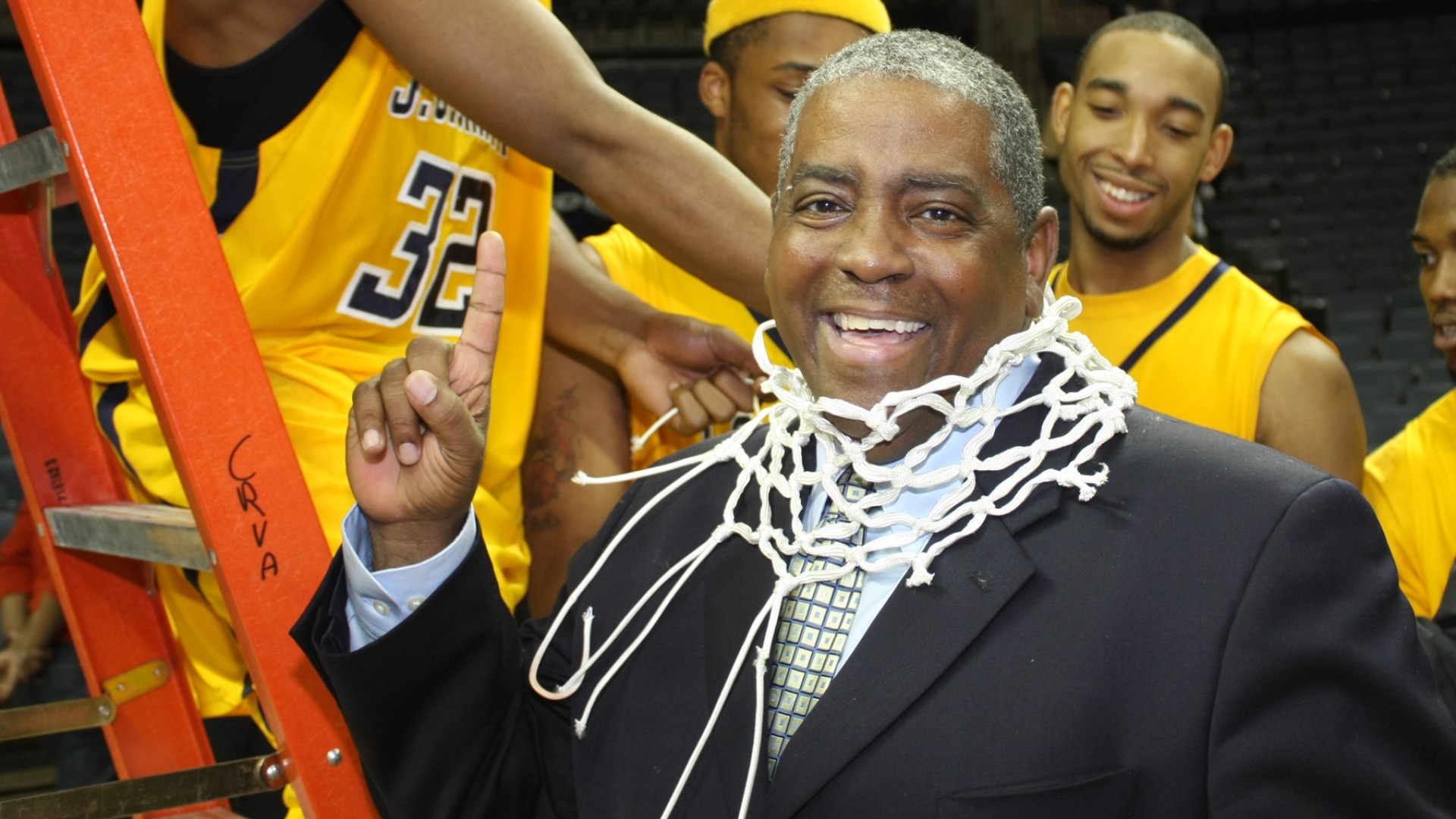 Steve Joyner Sr. With a basketball net around his neck at a CIAA Championship