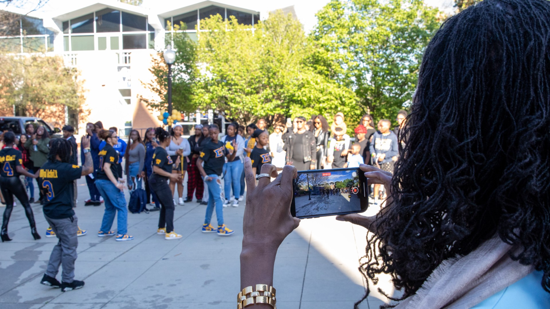 Dr. Kinloch catches video of students during the post-Inauguration party on the block