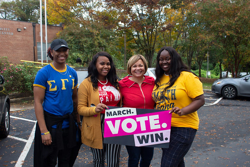 Students holding Vote signs with Charlotte Mayor Vi Lyles