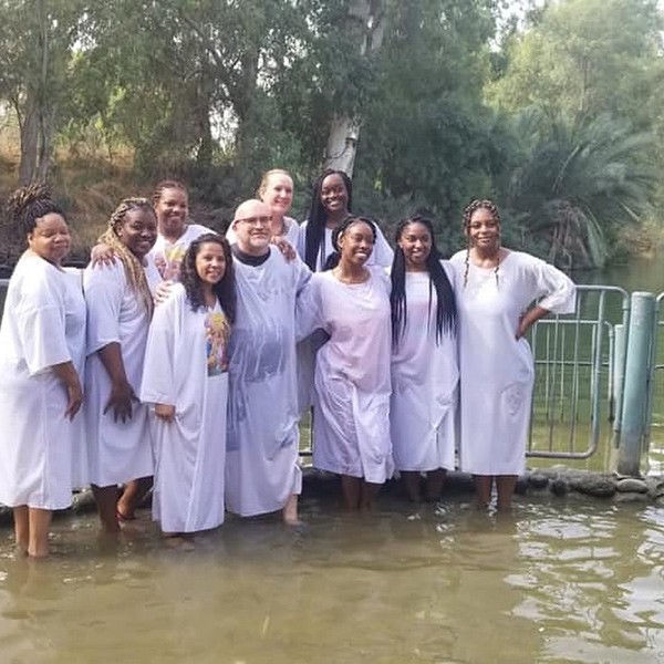 Group shot of the students after being baptized in the River Jordan