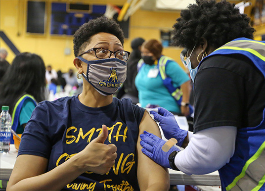 Dr. Haywood getting a vaccine at JCSU's vaccine clinic