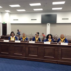 2023 debate team at desks