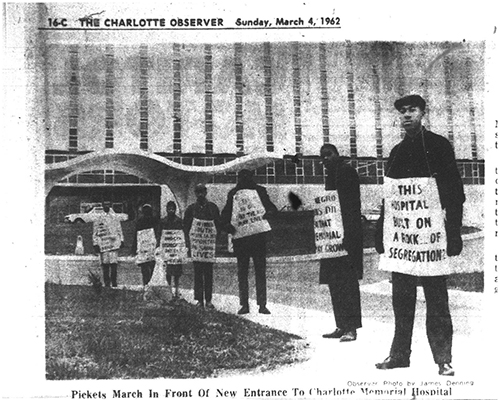 Photo of Charlotte Observer Article - Unidentified Man Tears Signs Of Negro Pickets At Hospital