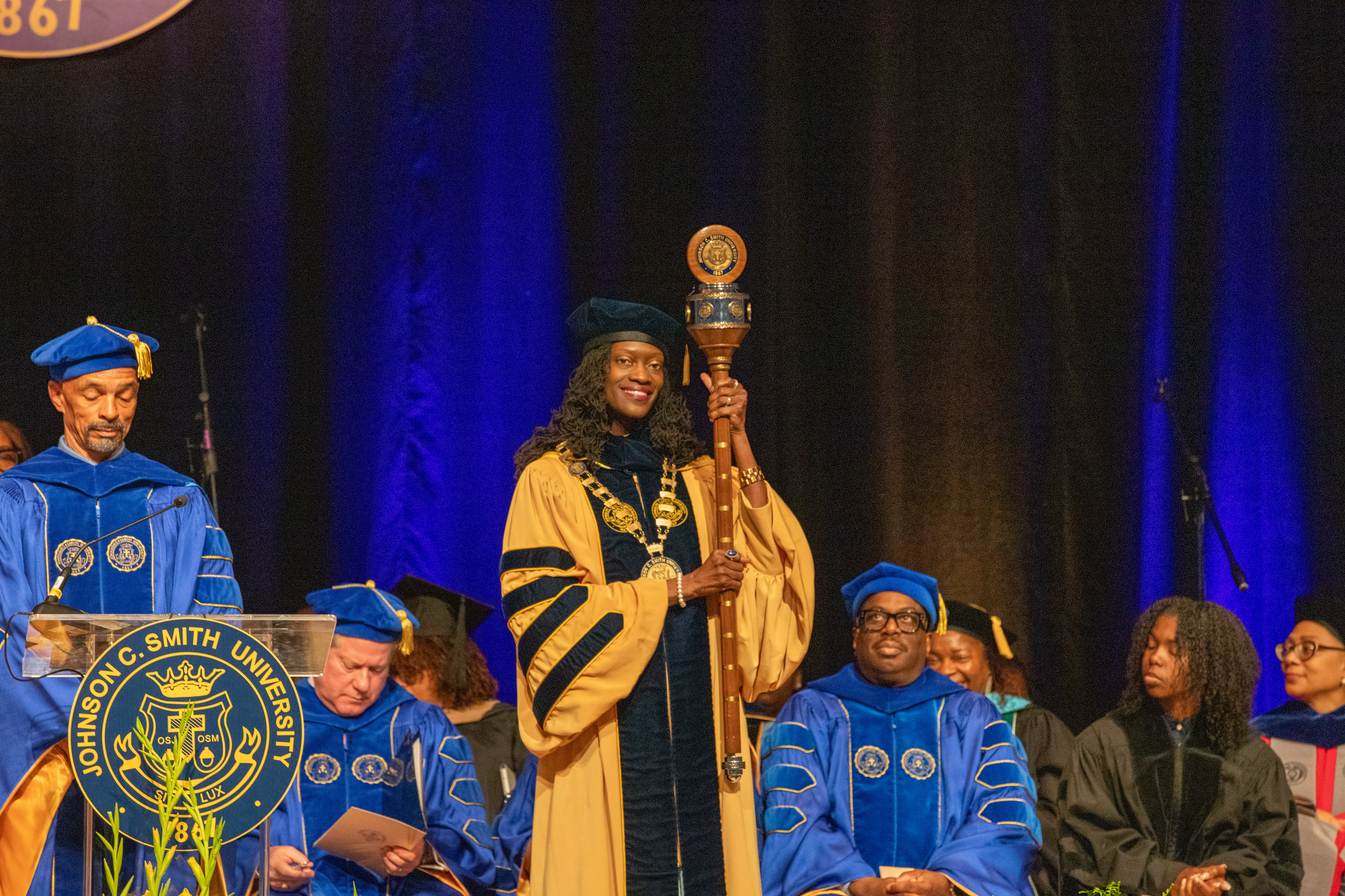 President Kinloch holding the mace during her inauguration