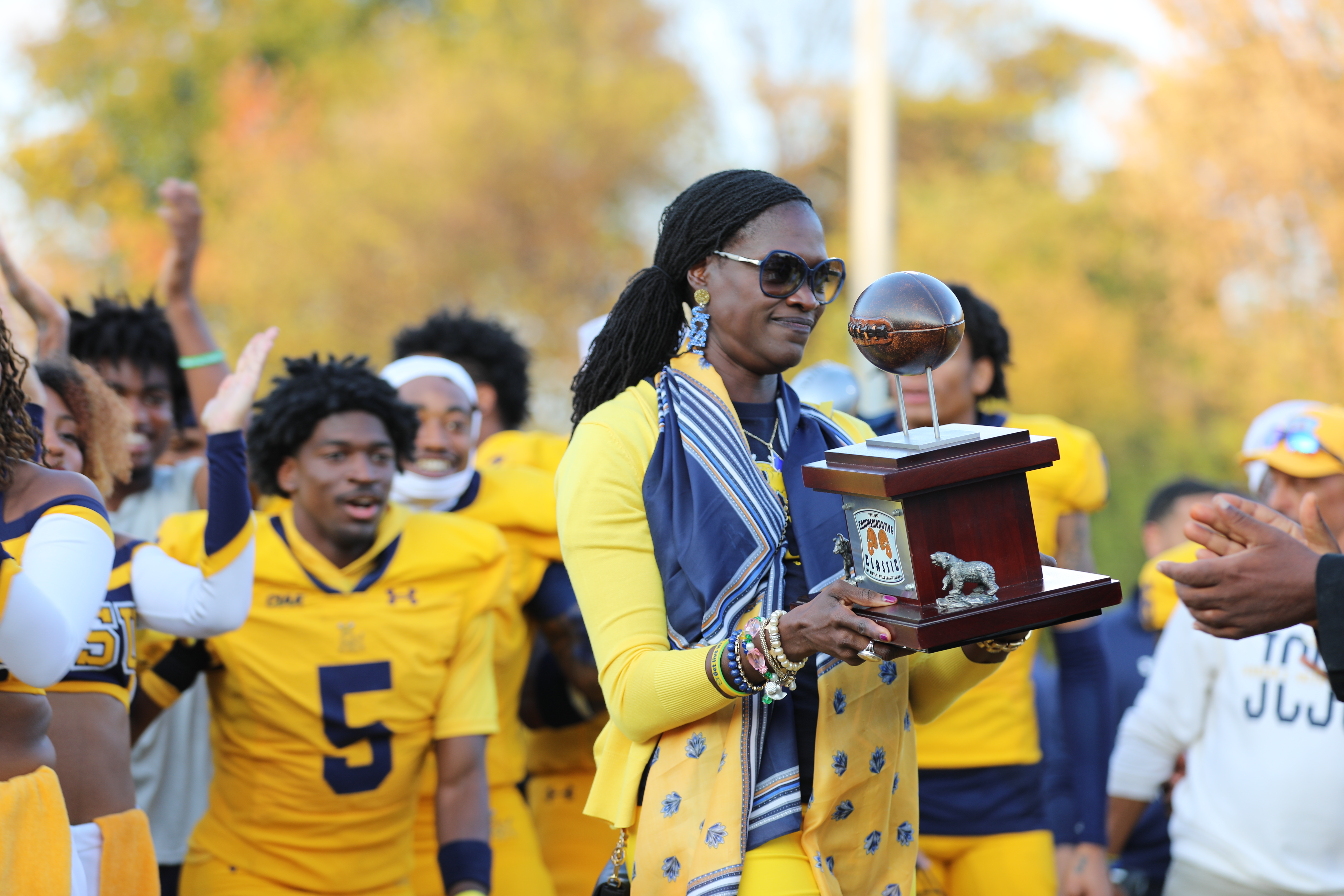 President Kinloch holding the Commemorative Classic trophy