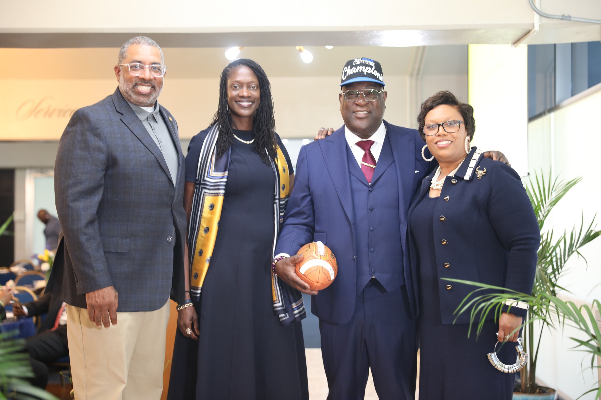 Coach Flowers, Dr. Kinloch, Reverend Kimber and Dr. Hendricks at the luncheon