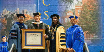 Wes More receiving his honorary diploma