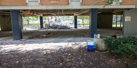 Photo of bulldozer clearing out Liston Hall lobbies