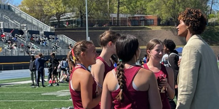 Anna Cockrell talks to students at the track meet