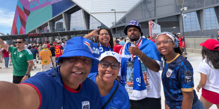 Dr. Terza Lima Neves' group posing outside the Atlanta stadium at the World Cup 2026