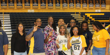 Photo of a group of students and President Kinloch at GBA