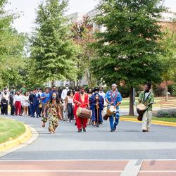 Students processing across campus to the church