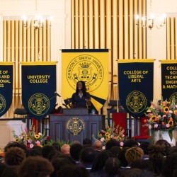President Valerie Kinloch '96 addressing the church during her Lyceum event