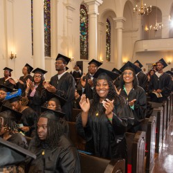 Student sing along to music performance at 2024 Baccalaureate