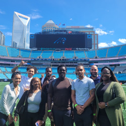 Students on the field at Panthers' Stadium
