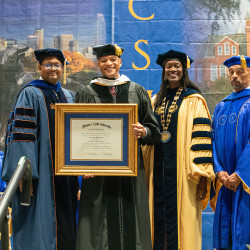 Wes More receiving his honorary diploma