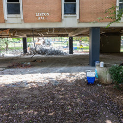 Photo of bulldozer clearing out Liston Hall lobbies