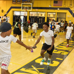 Kids at Impact Camp 2026 learning how track and field competitors  pass the baton 