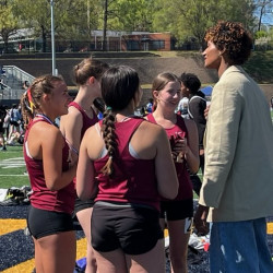 Anna Cockrell talks to students at the track meet