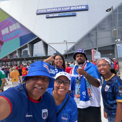 Dr. Terza Lima Neves' group posing outside the Atlanta stadium at the World Cup 2026