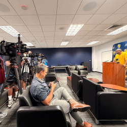 Photo of media talking to Coach Flowers