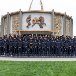 The 2026 Golden Bulls Football Team posing outside of the Hall of Fame