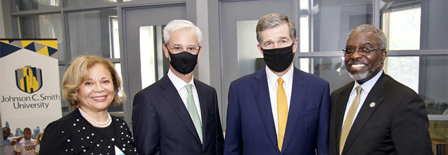 Mayor Vi Lyles, Wells Fargo CEO Charlie Scharf, N.C. Governor Roy Cooper, and President Armbrister pose for a photo after the event