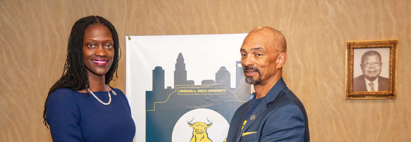 Trustee Steven L. Boyd congratulating Dr. Valerie Kinloch, JCSU's 15th President