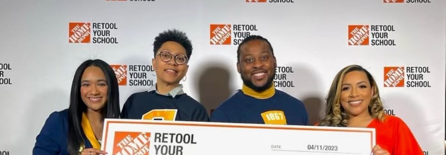 Group photo with check home depot