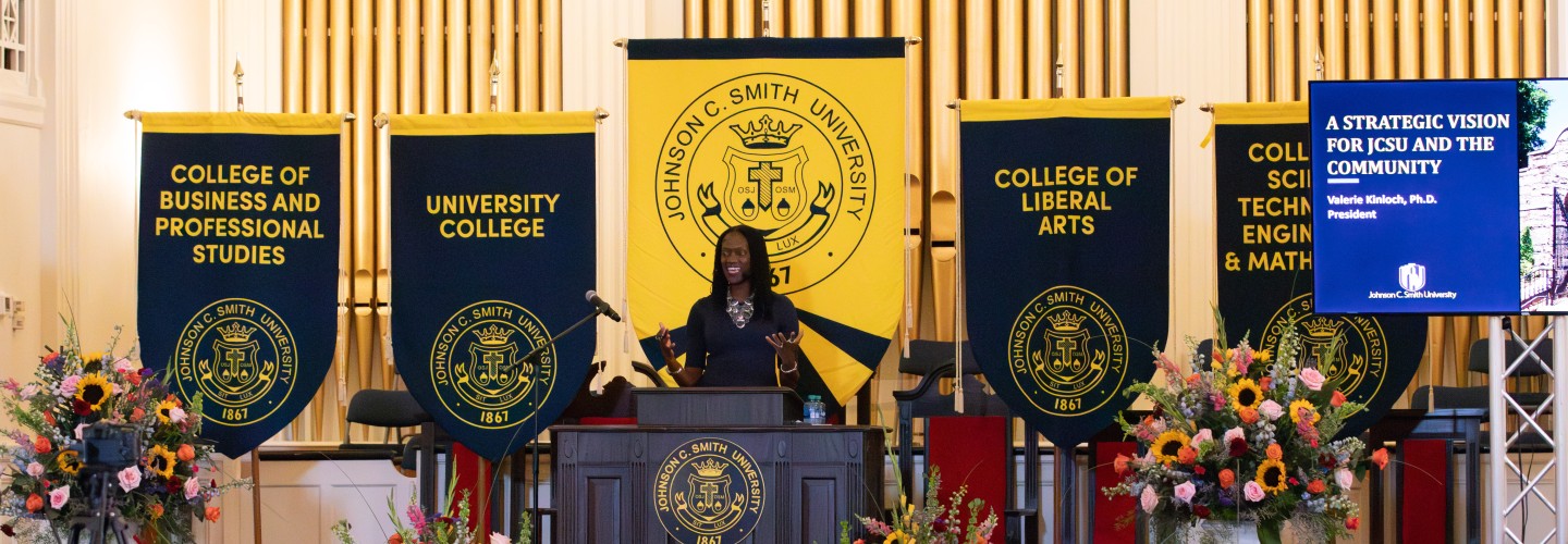 President Valerie Kinloch '96 addressing the church during her Lyceum event