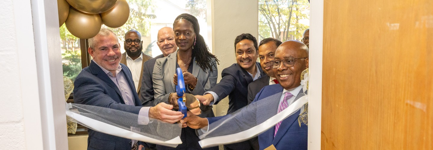 Cutting the ribbon at the opening of the lab
