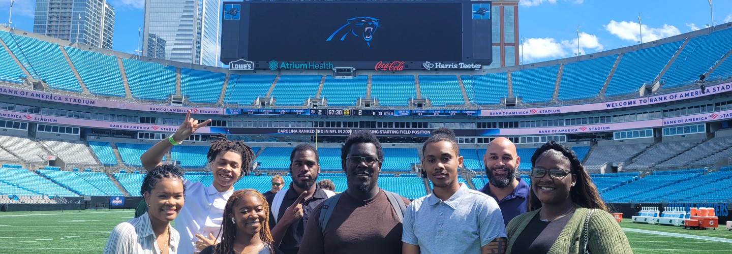 Students on the field at Panthers' Stadium