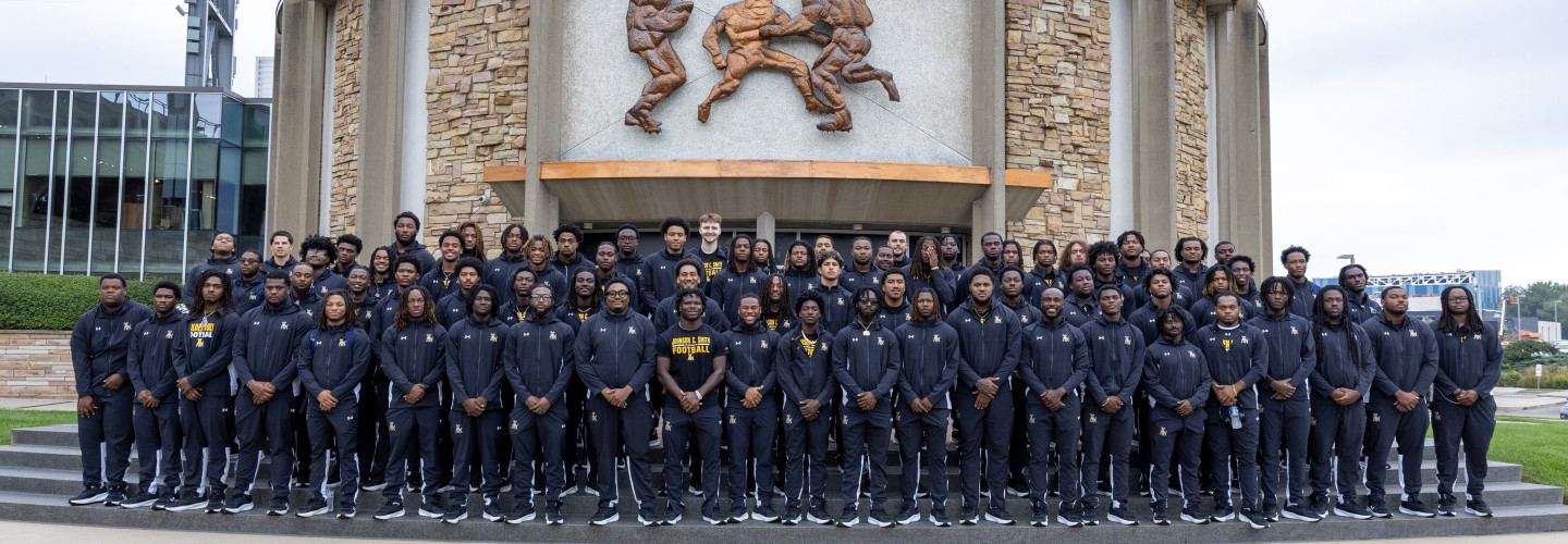 The 2026 Golden Bulls Football Team posing outside of the Hall of Fame