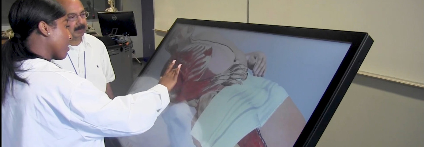 Student Working with Dr. Gupta at the Anatomage Table