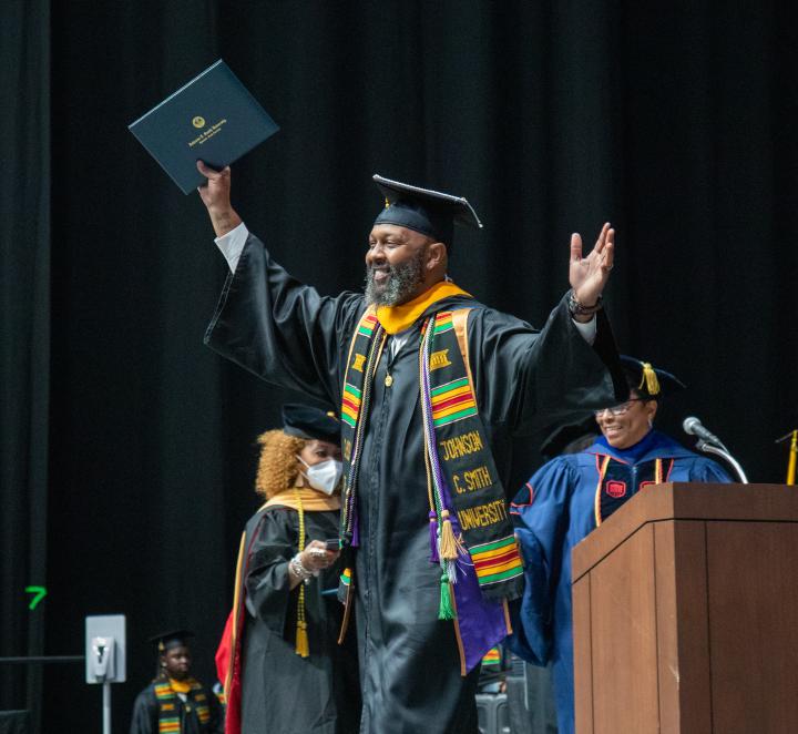 Graduate walks across the stage during the 2022 Commencement Exercises