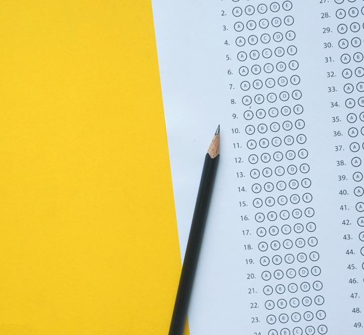 Exam paper on gold background