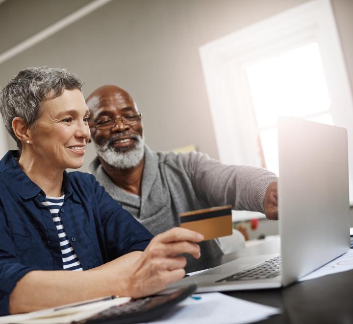 Retired couple looking at computer