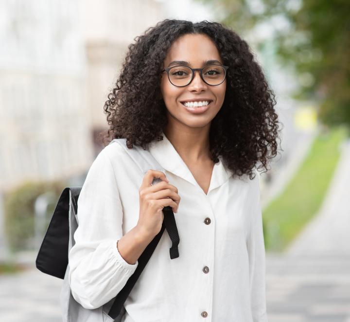 Student with backpack smiling