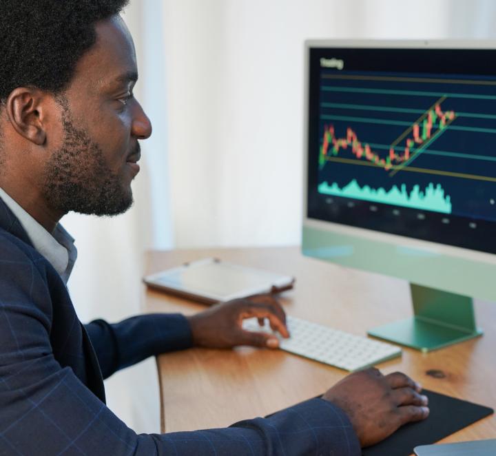 Man trading stocks on computer