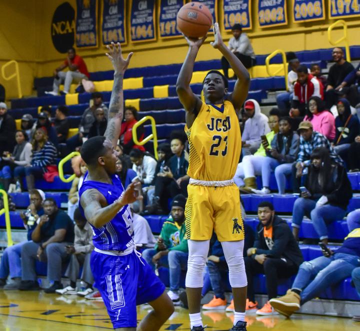 Golden Bull basketball player shooting a ball