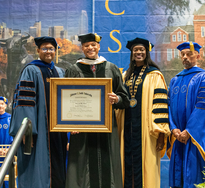 Wes More receiving his honorary diploma