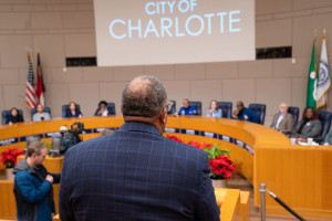 Coach Flowers standing before the Charlotte City Council