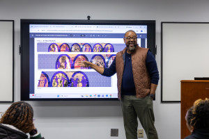 Utley showing his work to students