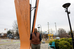 Utley standing next to his sculpture