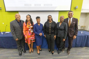 The panel poses together after the event