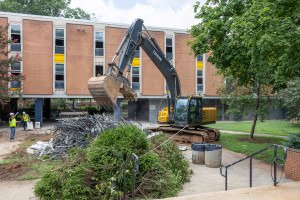 Backhoe begins process of tearing down Liston Hall