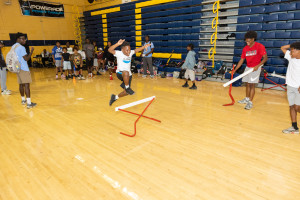 Kids attempting hurdles at 2026 IMPACT Camp