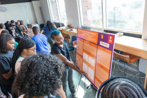 Student showing off research