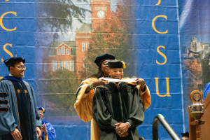JCSU 15th President Dr. Valerie Kinloch places the doctoral hood on Governor Wes Moore